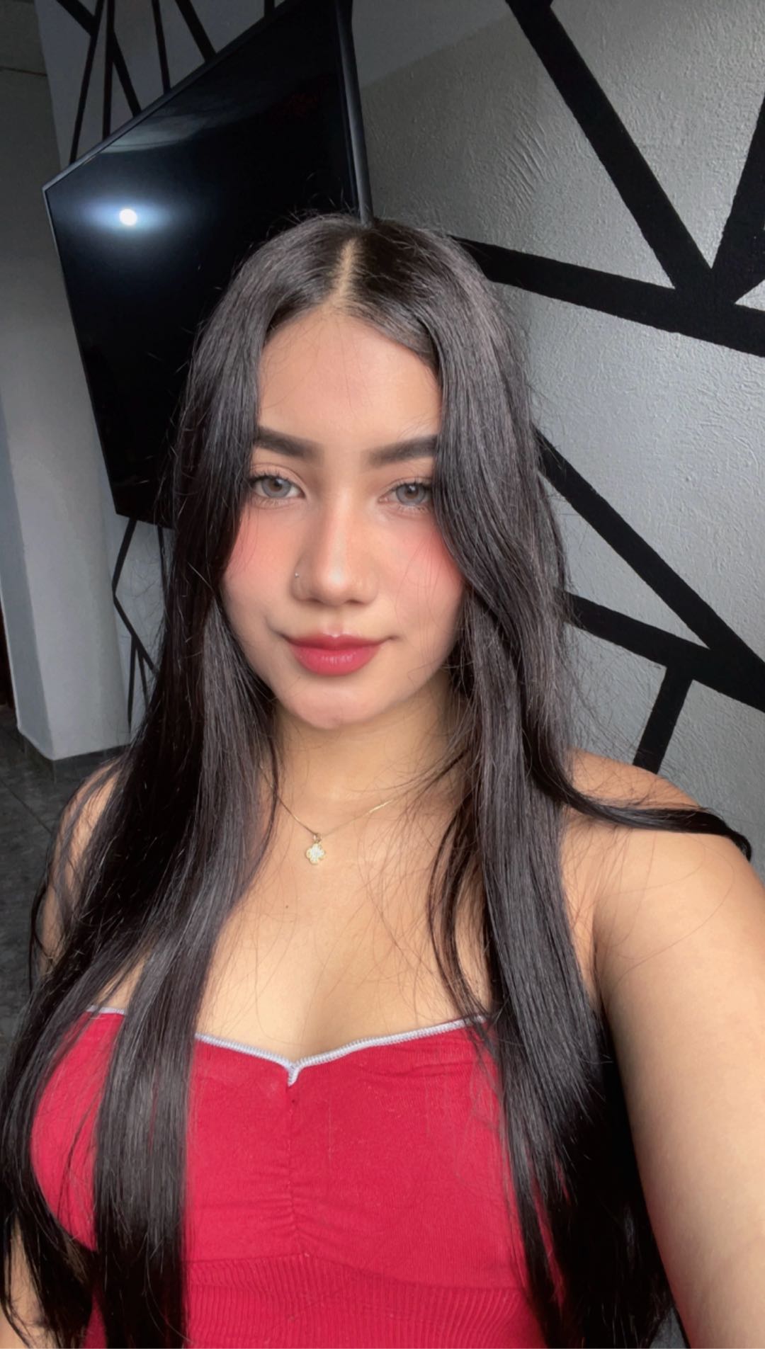 Woman looking into her front camera during a video chat