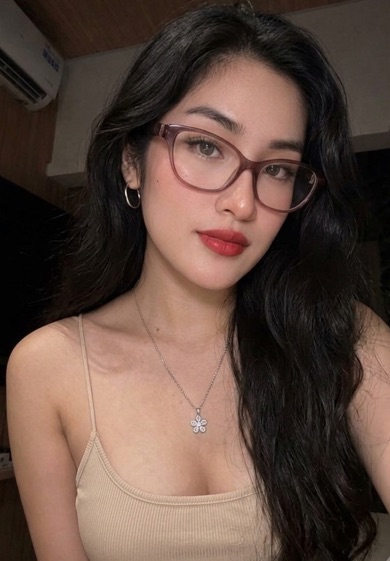 Woman in glasses with long dark hair
