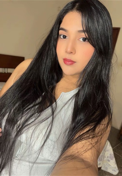 Woman in a white top taking a selfie
