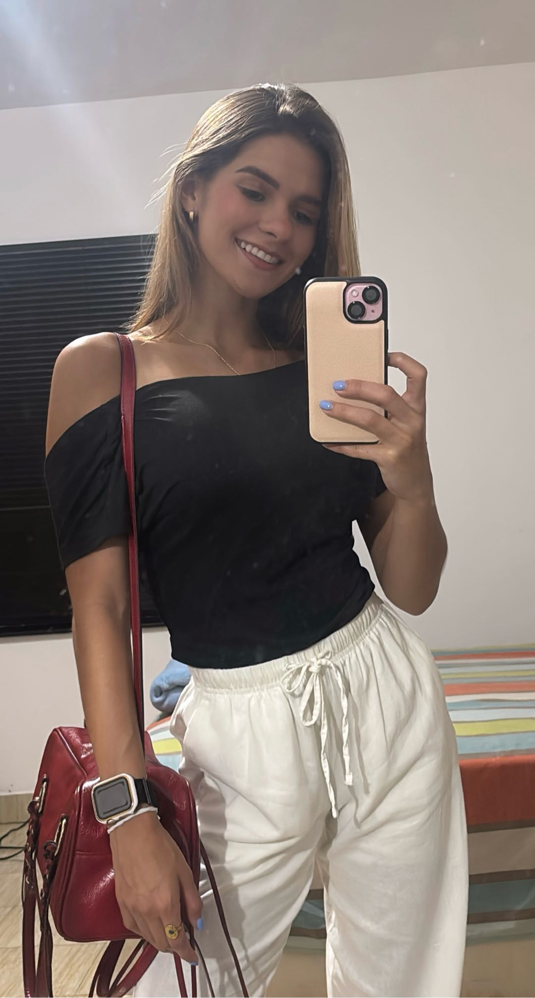 Woman holding up her phone camera in a bright room